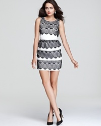 Classic in black and white, BCBGMAXAZRIA goes back to basics with this timeless dress, rendered in tiers of scalloped lace mixed with pintucked panels.