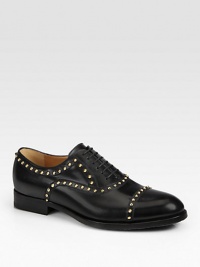 Black leather with antiqued gold cone-shaped stud hardware.Leather sole with micro GG rubber reinforcementMade in Italy