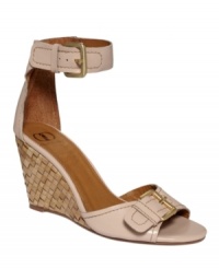 Amp up your feminine charm with the ladylike Gemini sandals by traditionally edgy Kelsi Dagger. A dainty strap accents the ankle while a slim, woven wedge heel grounds the look.