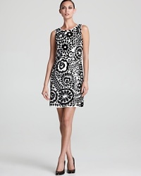 Aidan Mattox's 70's inspired shift lends a bold look in black and white--shiny sequins take on a floral form.