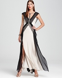 This BCBGMAXAZRIA gown feels decidedly modern in a color blocked silhouette and cool grey palette, dressed up with lace detailing.