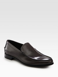 A finely crafted, moccasin-style slip-on is distinguished by debossed logo detail and stacked leather heel. Leather liningPadded insoleLeather soleMade in Italy