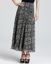 Lend elegant movement to your daily look with this tribal-print DKNYC maxi skirt. Play up the global sentiment with layered necklaces and stacked bangles.