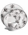 Compose a striking arrangement with the Black Orchid place setting by Michael Aram. Fine white Limoges porcelain flourishes under a dark watercolor motif inspired by foliage from around the world.