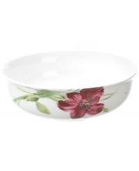 Painterly lilies bloom around this porcelain vegetable bowl, creating a beautiful arrangement with the rest of Oleg Cassini's Sweet Blossom dinnerware.