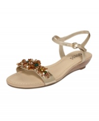 A balancing act. The Allia2 sandals by GUESS are a beautiful contrast with heavy beading atop the vamp of their dainty demi-wedge silhouette.