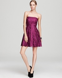 In jewel-tone metallic lace, this strapless Aqua dress lends a girlish look to festive affairs.