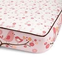 Birds frolic on blooming tree branches while shades of pink and orange highlight the coordinating floral print separated by brown piping. The American Academy of Pediatrics and the U.S. Consumer Product Safety Commission have made recommendations for safe bedding practices for babies. When putting infants under 12 months to sleep, remove pillows, quilts, comforters, and other soft items from the crib.