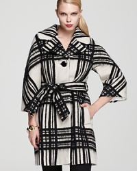 A classic plaid print goes strikingly oversize atop this kate spade new york coat for a bold addition to your winter wares. A touchable, textured finish adds interest to the statement style.