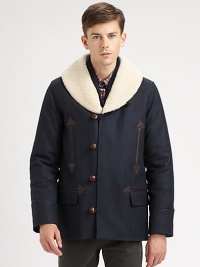 A winter classic topped with a shearling collar, toggle button-front and front pockets with exquisite leather trim.Button-frontChest welt, waist flap pocketsRear ventFully linedAbout 30 from shoulder to hemWoolDry cleanImportedFur origin: Portugal