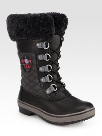 A cold weather favorite in quilted canvas and leather, lined with signature plush shearling. Shaft, 10Leg circumference, 13Canvas and leather upper with shearling trimShearling liningRubber trek solePadded insoleImported