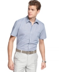 Go from work to the weekend with ease with this preppy short-sleeved woven shirt in a classic gingham pattern from Calvin Klein.