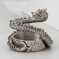 The grand form of a mythical dragon was the muse behind this sculptural hand-cast wine coaster from Natori.