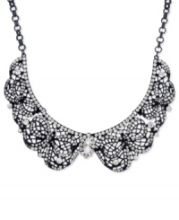 Get haute under this collar necklace from Betsey Johnson. Crafted from black-plated mixed metal, the necklace features an elegant filigree design and glass crystal accents for added luster. Approximate length: 17 inches + 3-inch extender. Approximate drop: 1-3/8 inches.