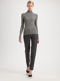 Ultra-soft finespun wool, in a rib-knit turtleneck style.TurtleneckLong sleevesMerino woolDry cleanImported of Italian fabricModel shown is 5'10 (177cm) wearing US size Small. 