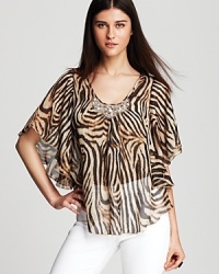 A vibrant swirl of tiger stripes enlivens this sheer Karen Kane top, finished with a beaded neckline for a glamorous walk on the wild side.