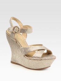 Encrusted in shimmering glitter, this leather slingback has an adjustable ankle strap and covered platform. Self-covered wedge, 5 (125mm)Covered platform, 1½ (40mm)Compares to a 3½ heel (90mm)Glitter-coated leather upperLeather lining and solePadded insoleImportedOUR FIT MODEL RECOMMENDS ordering one size up as this style runs small. 