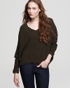 A boxy silhouette lends a relaxed fit and feel to this casual-chic sweater, rendered from a very soft wool blend.