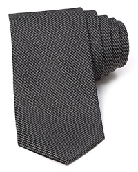 A micro basketweave pattern lends a classic look to this luxe silk tie from The Men's Store at Bloomingdale's.