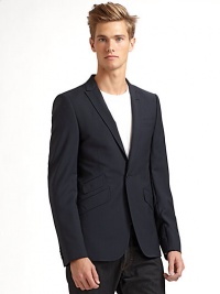 THE LOOKPeaked lapel with button opening One-button front Long sleeves with four button cuffs Single welt pocket at chest Three flap pockets at front Single vent at backTHE MATERIALVirgin wool Cupro liningCARE & ORIGINDry clean Imported