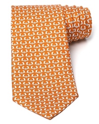 Slick dolphins do their tricks atop a classic silk tie from Salvatore Ferragamo.