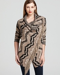 With a southwestern print and fringed trim, this Heather B cape lends a rustic finish to your every look. Slip the style over leather leggings for a sophisticated texture contrast.