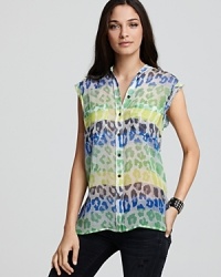 Animal print and color blocking combine on this Equipment blouse in a juxtaposition of two trends that make for one wild style.