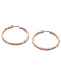 Non-stop glitz from Fossil. These classic hoop earrings embrace modern trends with rosy hues and pave crystal accents. Crafted in rose-gold tone mixed metal. Approximate diameter: 1-3/8 inches.