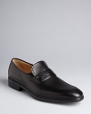 A traditional penny loafer design rendered in exceptionally smooth leather grounds your look in classic luxury.