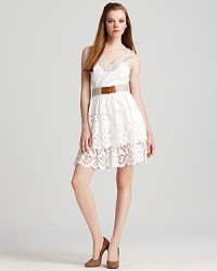 Spring's white trend is perfected with this simply beautiful Milly dress, rendered in lasercut cotton with a tiered ruffle hem. Belted at the waistline, the feminine silhouette is guaranteed to be the focal piece at your upcoming fête.