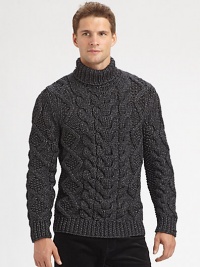 A chunky, cable-knit turtleneck, shaped in a fine wool blend, offers superior warmth and comfort on those brisk, winter days.Ribbed knit cuffs and hem56% wool/44% polyesterDry cleanImported