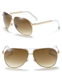 White metal aviator sunglasses with accented top bar and double bridge. Goldtone and enamel design on arms Adjustable nose pads for secure comfort.