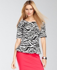 Make your next ensemble pop with INC's vibrant petite top, adorned with a bold zebra print and a peplum hem.