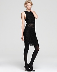 A sheer cocktail party stunner, this new Alice + Olivia dress was designed to attract double-takes with intricate beading, sequin details and sheer embroidered cutouts on front and back.