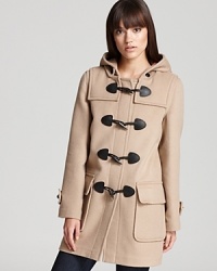 Featuring a timeless plaid silhouette punctuated with rustic toggle closures, this Burberry Brit coat is a chic addition to your cold-weather repertoire.