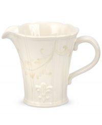 With embossed lilies and golden leaves, Portmeirion's decorated Fleur de Lys creamer sets tables in the French tradition. Classic, fluted stoneware in warm ivory lends distinct old-world elegance to everyday dining.