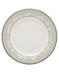 These elegant bone china side plates showcase a delicate floral design with textured white beads and stunning platinum trim. Designed for holding dinner rolls and breads and equally useful for cakes and cookies at tea time. From the Lenox dinnerware collection.