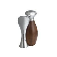 A splendid example of functional beauty, this exquisite set evokes a life well-lived, surrounded by deeply pleasing, well-made objects. The salt shaker nestles into the pepper grinder for a gratifying balance of warm natural wood and polished Nambé alloy, with shapes that fit the fingers just so