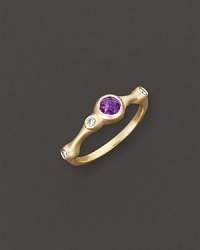 A faceted amethyst and brilliant diamonds add bright color to gleaming 18K yellow gold. By Carelle.