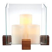 Create an artful showcase of candlelight and favorite objects displayed inside this striking piece from Dansk. In an elegant pairing of raw materials and minimalist design, blocks of richly grained wood support thick panes of sparkling clear glass.