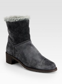 This versatile suede design with faux fur trim and lining can be folded over for a short silhouette. Stacked heel, 1¾ (45mm)Suede upper with faux fur trimPull-on styleFaux fur liningRubber solePadded insoleImported