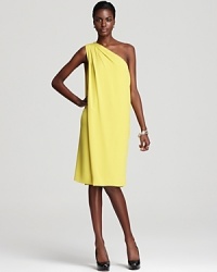 Elegantly draping from one shoulder, this gorgeously elemental silk dress in a lemon-bright hue is perfect for a summer wedding - or a cocktail party year-round.