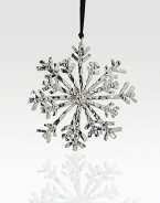 Elegant and timeless, this glistening snowflake form will beautifully adorn your tree.HandmadeNickelplate4 diam.Imported