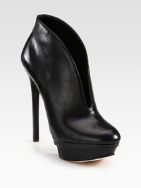 A deep vamp modernizes this leather platform ankle boot with glossy patent trim. Self-covered heel, 5½ (140mm)Covered island platform with patent leather trim, 1¾ (45mm)Compares to a 3¾ heel (95mm)Leather upperPull-on styleLeather liningLeather and patent leather solePadded insoleImported