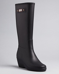 Stay high and dry in these wedge rain boots that add an elevated point of view to your favorite Hunter style.