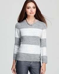 Subtle sequin embellishment lends chic luster to a striped Isaac Mizrahi Jeans sweater for a luxe everyday look.