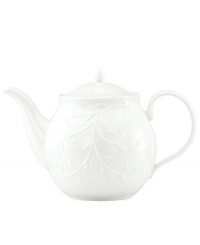 An elegant white-on-white pattern, embossed vine motif and interior glaze lend the Lenox Opal Innocence Carved teapot to refined dining every day.