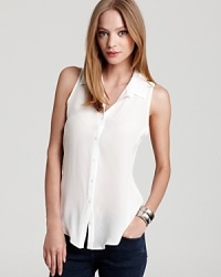 A great alternative to the simple white t-shirt, this Aqua blouse is just as comfortable with a fashion-forward twist. For an occasional casual-cool accent, tie the front at the hem.