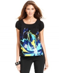 Style&co.'s petite tee features a bold graphic print and flattering pleated neckline!