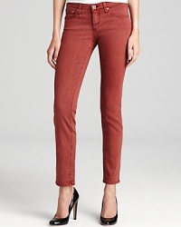 Color washed for a chic alternative to denim, these skinny-fit AG Adriano Goldschmied jeans warm up your your collection in a new hue and classic five-pocket silhouette.